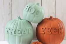orange and light green faux pumpkins with matching letters are amazing for fall and Halloween decor