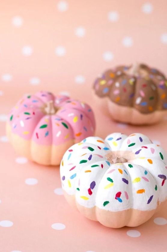 pretty pumpkins turned into donuts with glazed and confetti are amazing for Halloween decor