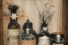lovely vintage bottle decor arrangement for halloween decor