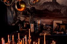 vintage Halloween table decor with skulls, bones, candles and a cloche is a beautiful and easy to DIY idea
