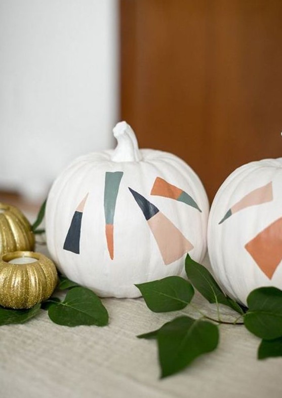 white pumpkins decorated with bold color block candy corns are great for delicate Halloween decor