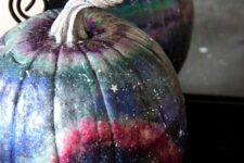 02 a beautiful blue, pink, grey and purple galaxy pumpkin with little white and silver stars and constellations for Halloween