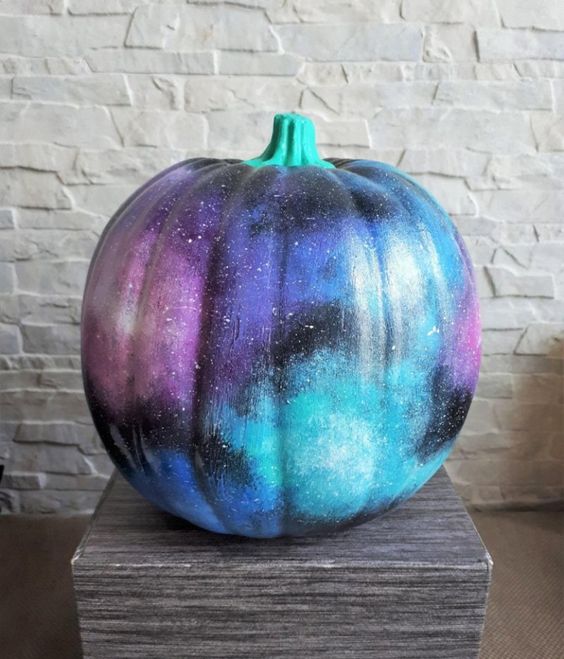 a bright and cool galaxy pumpkin with barely there constellations and lights is a beautiful solution not only for Halloween but also for the whole fall