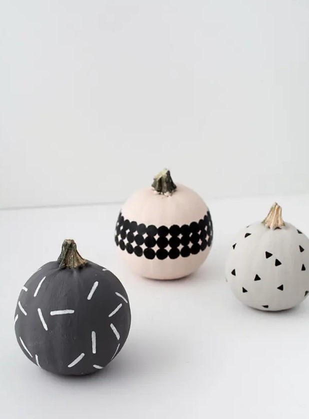 modern patterned pumpkins made using paints, stencils and stickers look nice and cool and will be a great idea for modern Halloween