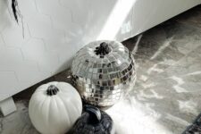 05 modern Halloween pumpkins – a white one, a black and white sharpie one, a disco ball one for a bold party
