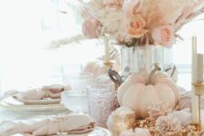 06 a fab pastel Thanksgiving tablescape with chargers with pearls, blush napkins, blush blooms, pampas grass and blush pumpkins
