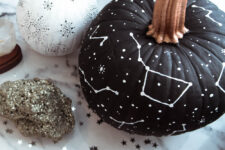 08 a matte black pumpkin with white constellations and stars drawn with a simple white sharpie is a gorgeous idea for Halloween