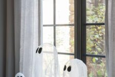 08 an arrangement of cheesecloth ghosts is a lovely idea for Halloween, great for kids’ parties