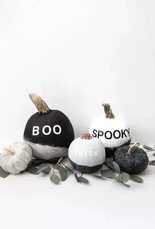 make a display of cool black and white glitter pumpkins with vinyl letters - they are very easy to DIY