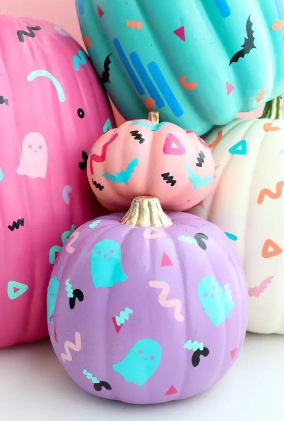 neon pink, purple, turquoise pumokins decorated with bold sharpies are a fun and cool idea for Halloween