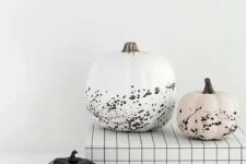 10 gorgeous modern Halloween pumpkins – a white, black and blush one with splatters are awesome