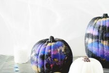 11 black, purple and gold galaxy-themed pumpkins are amazing for Halloween, bold, catchy and mysterious