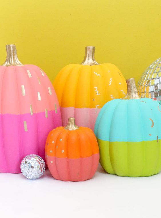 bold color block neon pumpkins with gold touches are a lovely and chic idea for styling a modenr neon Halloween party