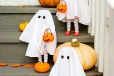 11 fun cheesecloth ghosts with candy baskets are lovely decor that will offer sweets for kids