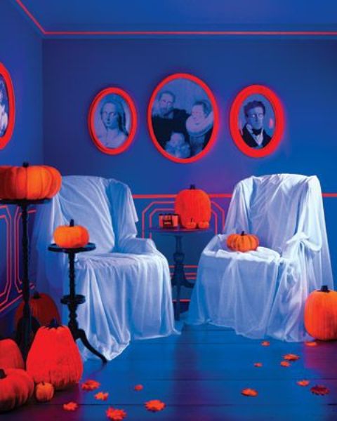 a blue room with neon orange touches here and there is a gorgeous solution for a Halloween neon party