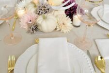 13 a lovely glam Thanksgiving tablescape with wihte pumpkins, antlers, blush, white and purple blooms, candles, white porcelain and blush glasses