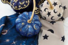 13 very pretty small pumpkins in blue, navy and white, with stars, moons and tiny sparkles are great for celestial Halloween parties
