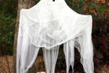 14 hang a life-size ghosts on a tree or in your front porch to make your Halloween decor ultimate and super cool