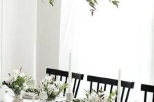 15 a modern and very neutral Thanksgiving tablescape with neutral porcelain and linens, greenery and white blooms plus white candles