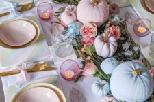 15 a pastel glam Thanksgiving tablescape with a greenery and pink bloom runner, pink and blue pumpkins, pink candleholders and pink plates