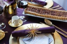 16 a purple and gold glam Thanksgiving tablescape with purple linens and calla lilies, gold touches and refined modern glasses