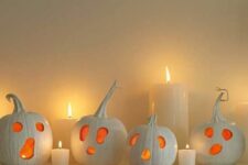 17 white ghost pumpkins as jack-o-lanterns for Halloween are a simple and cool solution that you can easily DIY