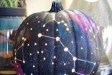 18 a galaxy pumpkin is a trendy idea for those of your who enjoy celestial Halloween decor and want something special