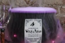 19 a cauldron with purple fog potion and lights is amazing and very eye-catchy for Halloween decor