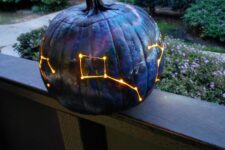 19 a gorgeous galaxy pumpkin luminary in blakc, navy and purple is a fantastic idea for Halloween, it looks bold