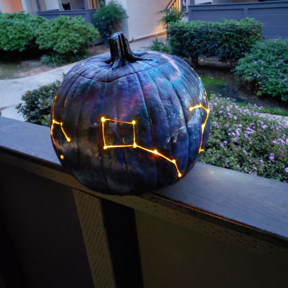 a gorgeous galaxy pumpkin luminary in blakc, navy and purple is a fantastic idea for Halloween, it looks bold