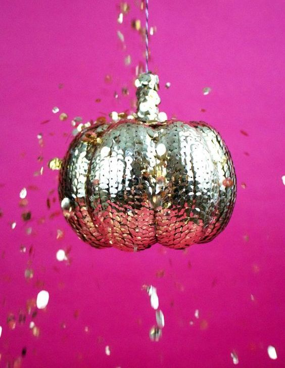 a lovely gold sequin pumpkin is a fantastic decor idea for a Halloween party, it looks wow