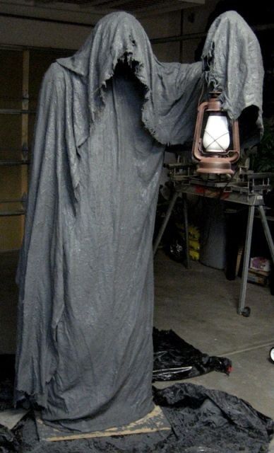 a scary and dark ghost like this one will be a frightening idea for an outdoor Halloween space