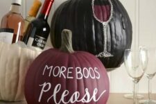 23 a matte burgundy pumpkin, a glossy black one with letters and a wine glass crafted on the pumpkin are amazing for Halloween