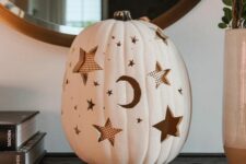 an elegant white pumpkin carving idea for halloween