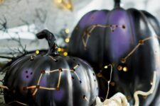 26 black and purple Halloween pumpkin luminaries with gold constellations are amazing for indoor and outdoor decor