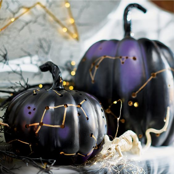 black and purple Halloween pumpkin luminaries with gold constellations are amazing for indoor and outdoor decor