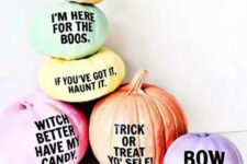 27 an arrangement of Halloween pumpkins with fun and quirky phrases on them for a modern touch