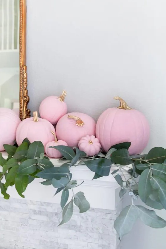 beautiful Thanksgiving mantel decor with matte pink pumpkins and lush greenery is a lovely idea to rock in your space