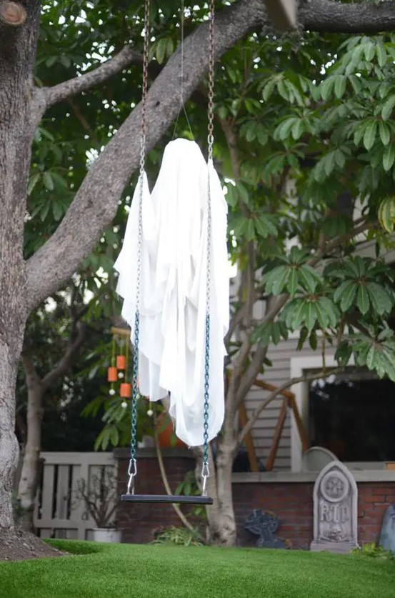 attach a cheeseloth ghost to a swing and it will seem that it's floating in the air when it gets dark, great for Halloween decor