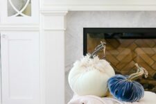 35 pink, navy and white fabric pumpkins and greenery are great to style your mantel for fall and Thanksgiving