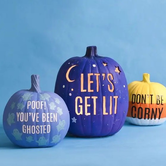 modern colorful Halloween pumpkins in lilac, purple and orange, with drilled letters, stenciled ones and some letters