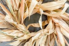 a beautiful and all-natural corn husk and wheat wreath is a great idea for fall outdoor decor and looks lovely