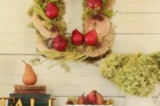 a true harvest wreath of wood slices, veggies, fruits and herbs is a fun and creative idea for Thanksigiving