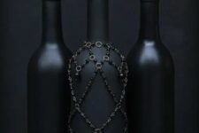 black glossy and black matte bottles with chain, beads and skulls on top are amazing for Halloween