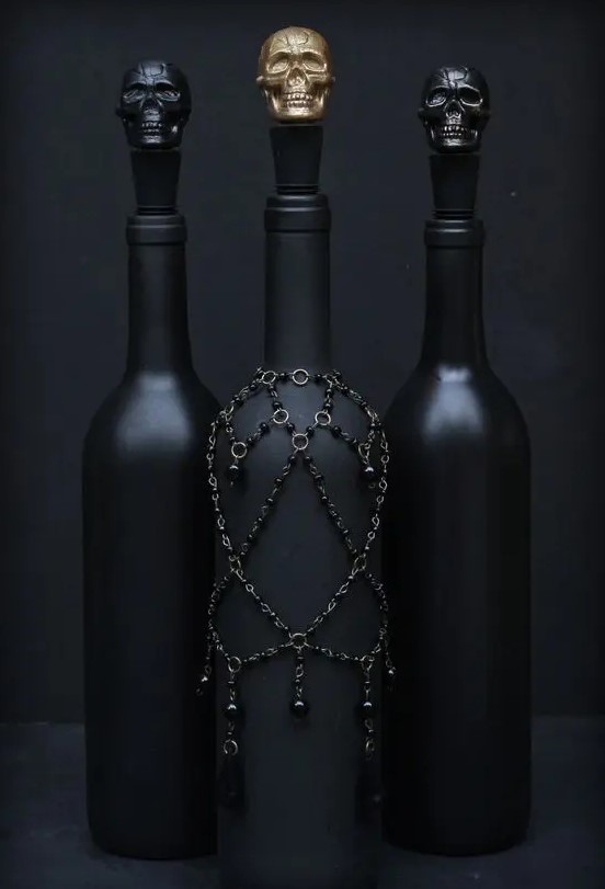 black glossy and black matte bottles with chain, beads and skulls on top are amazing for Halloween