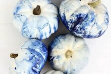 bold blue marble pumpkins are easy to DIY and will give a modern feel to your space easily