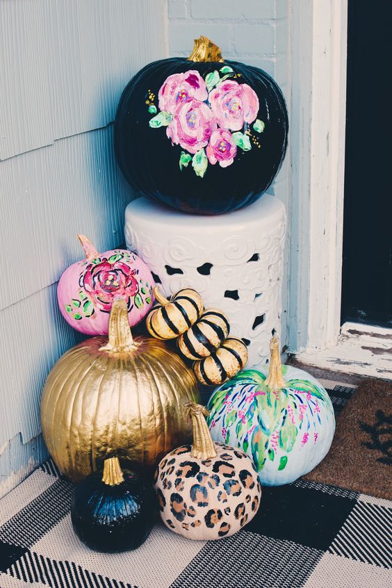 bright fall pumpkins - black with pink florals, pink, green, leopard, gold and blakc stripe ones - for fall porch decor
