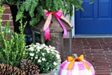 bright stenciled pumpkins in pink, hot pink, orange and white is a fun and colorful idea