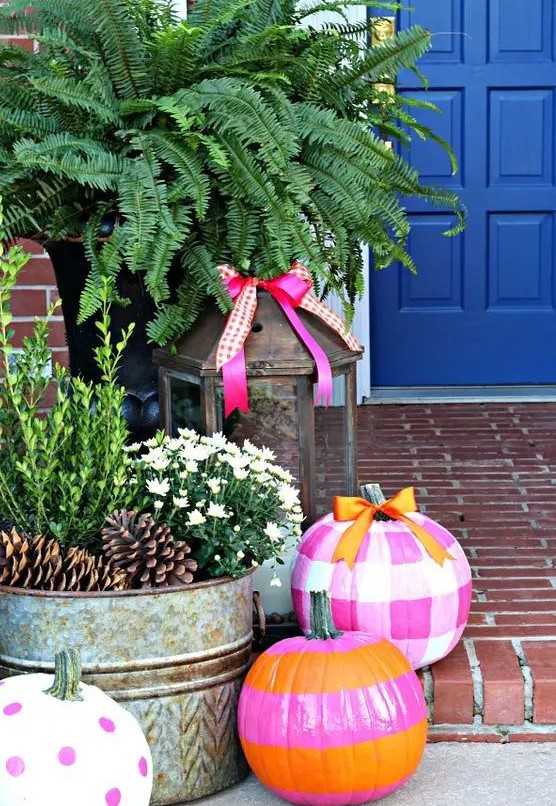 bright stenciled pumpkins in pink, hot pink, orange and white is a fun and colorful idea