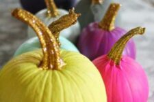 colorful fall pumpkins with gold glitter stems are amazing for fun and modern fall and Thanksgiving decor